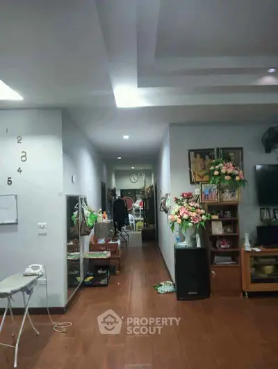 Spacious living room with modern decor and wooden flooring