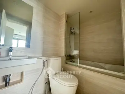 Modern bathroom with sleek design and bathtub in contemporary apartment