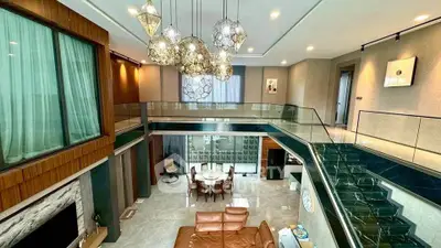 Luxurious modern living room with high ceiling and elegant lighting