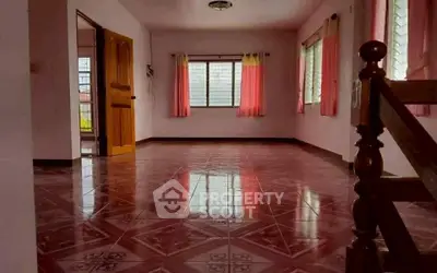 Spacious empty living room with glossy tiled floor and pink curtains