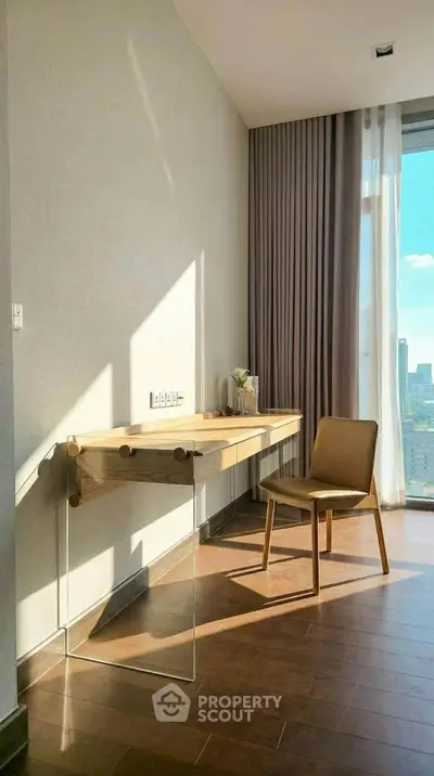 Bright study area with modern desk and chair, large window with city view, and elegant curtains.