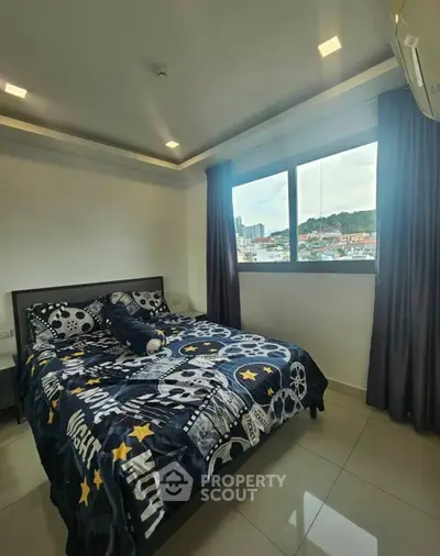 Modern bedroom with large window offering city view, stylish decor, and sleek flooring.