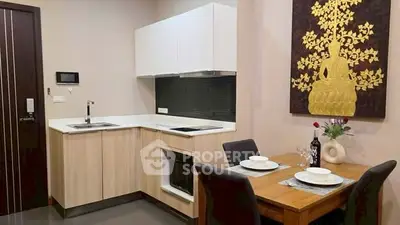 Modern kitchen with dining area featuring sleek cabinetry and elegant decor.