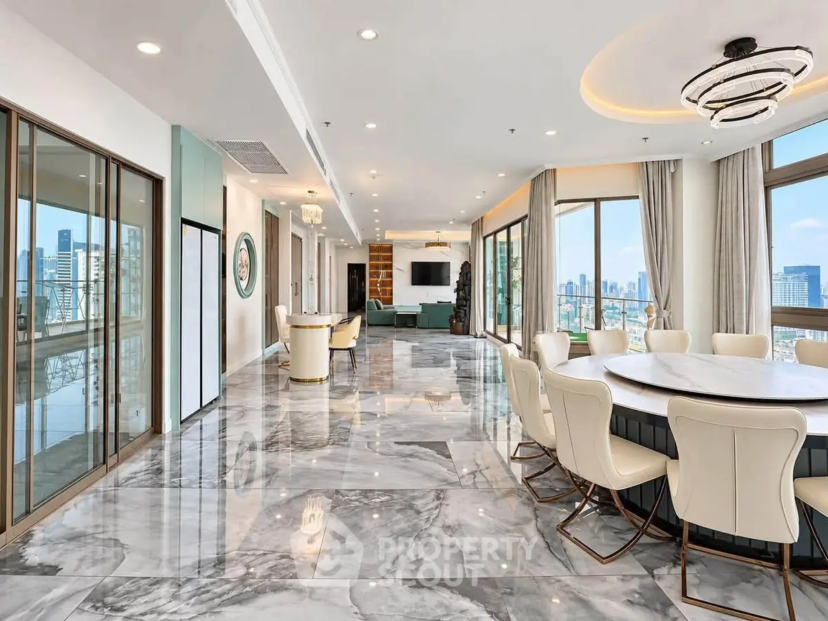 Luxurious open-plan living room with marble floors and stunning city views.
