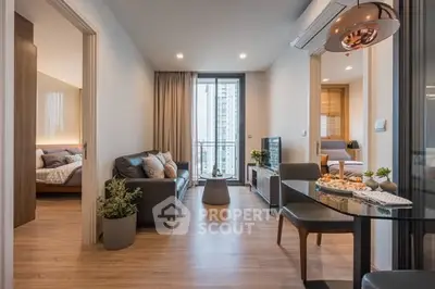 Modern open-plan living room with stylish decor and city view