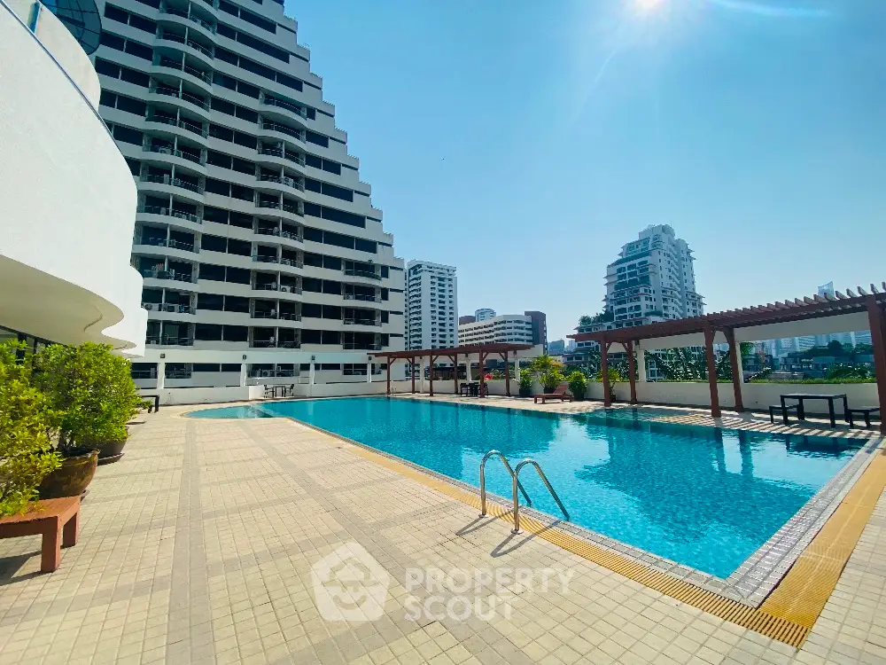 Luxurious high-rise building with stunning pool and city views