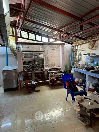 Spacious kitchen with open layout and ample storage space.