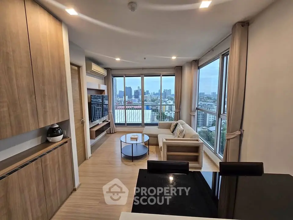 Modern living room with panoramic city view and stylish furnishings
