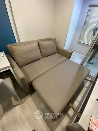Modern living room with stylish sofa bed and sleek decor