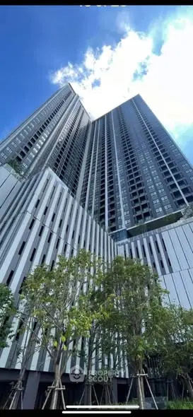 Stunning high-rise building with modern architecture and lush greenery