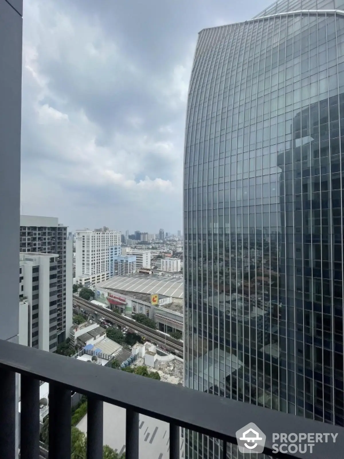 Stunning cityscape view from high-rise balcony with modern architecture