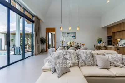 Luxurious open-plan living room with pool view and elegant decor
