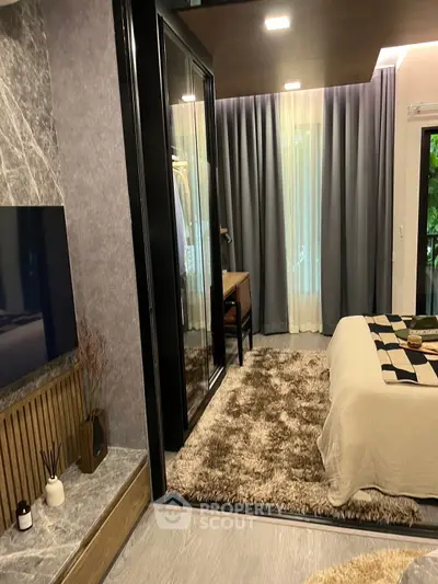 Luxurious bedroom with modern decor and stylish furnishings, featuring a cozy bed and elegant wardrobe.
