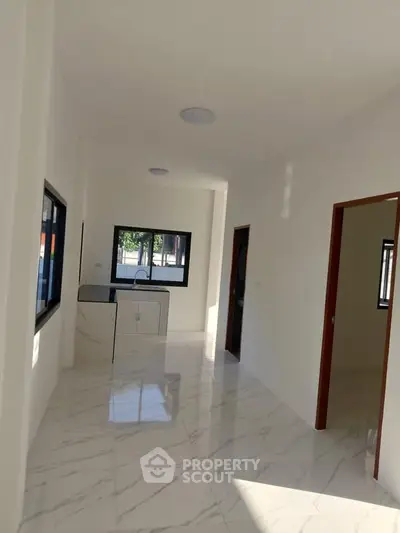 Spacious modern kitchen with sleek design and ample natural light