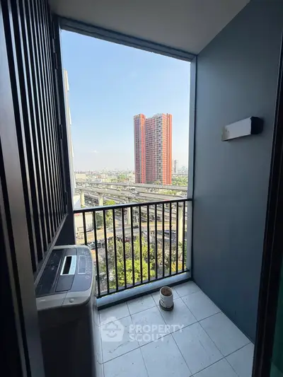 Charming balcony with city view and washing machine, perfect for urban living.