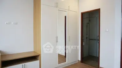 Modern bedroom with built-in wardrobe and ensuite bathroom