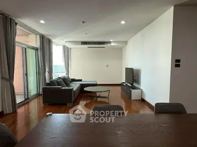 Spacious modern living room with sleek furniture and large windows