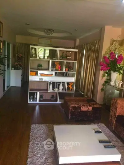 Spacious living room with elegant decor and plush seating in a modern home.