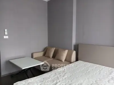 Cozy bedroom with modern sofa and minimalist decor