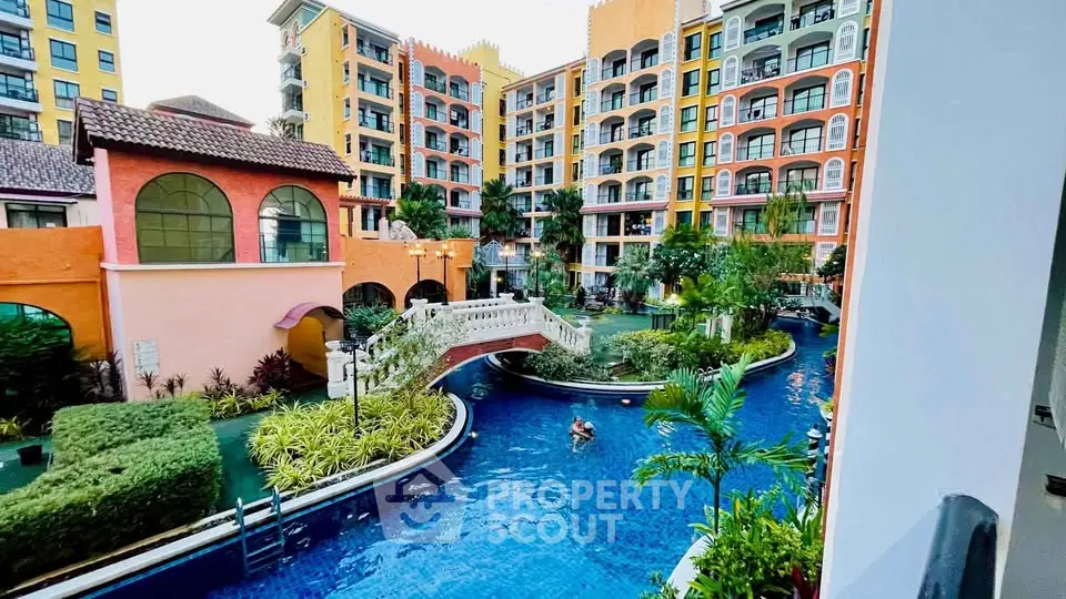 Luxurious resort-style apartment complex with stunning pool and lush gardens.