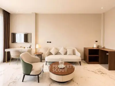 Elegant modern living room with stylish furniture and marble flooring, perfect for luxury living.