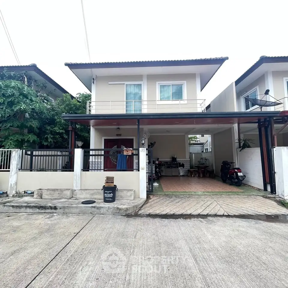 Charming two-story house with a spacious driveway and modern facade in a serene neighborhood.