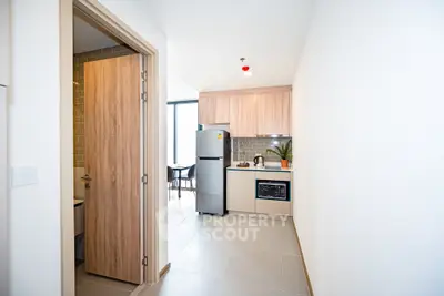 Modern kitchen with sleek appliances and open layout in a contemporary apartment