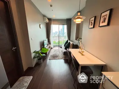 Modern living room with city view, stylish decor, and cozy atmosphere in urban apartment.