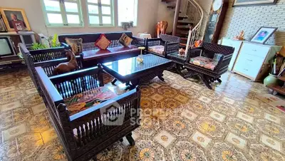 Charming living room with vintage wooden furniture and patterned tile flooring