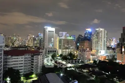 Stunning city skyline view with illuminated skyscrapers at night, showcasing urban living at its finest.