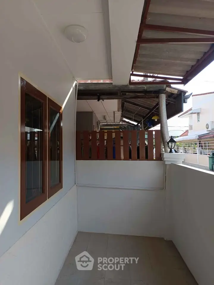 Charming balcony space with potential for outdoor relaxation and decor.