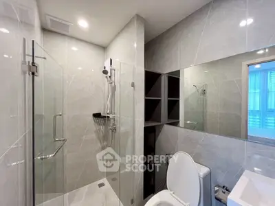 Modern bathroom with sleek glass shower and elegant fixtures