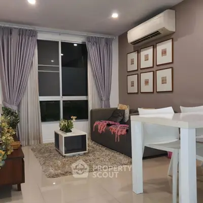 Cozy living room with modern decor, featuring a plush rug, elegant curtains, and stylish wall art.