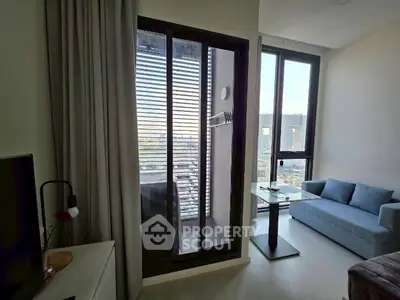 Modern living room with balcony view in high-rise apartment