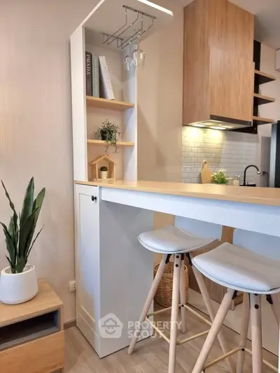 Modern kitchen with stylish breakfast bar and wooden accents