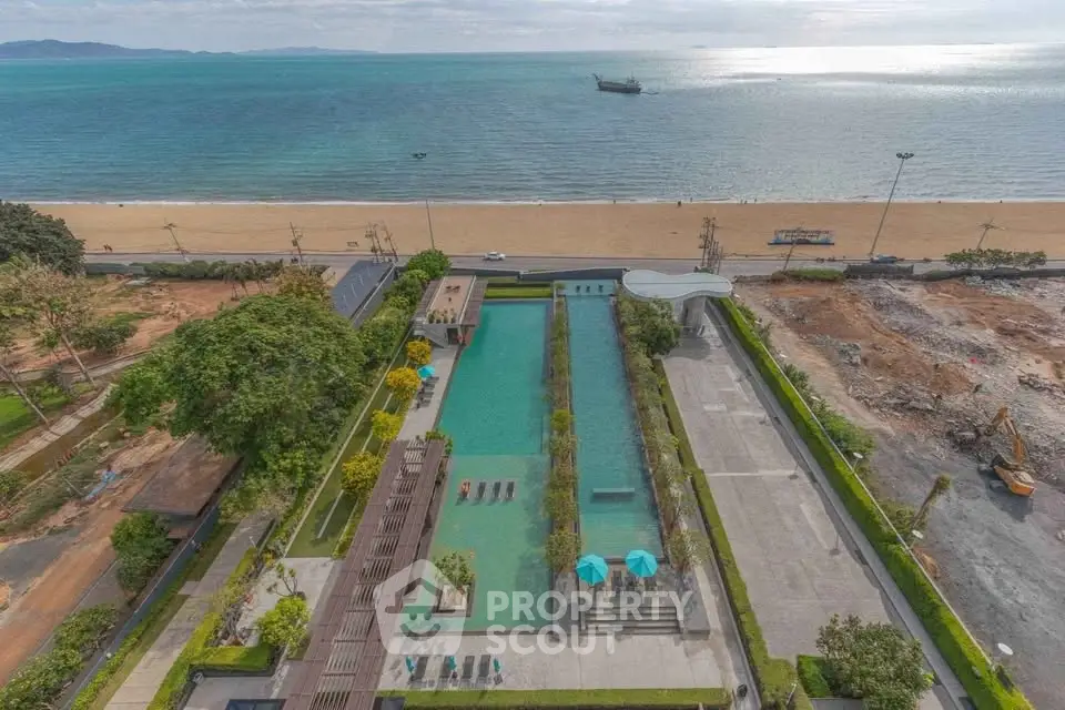 Luxurious beachfront property with stunning pool and ocean view, perfect for relaxation and leisure.