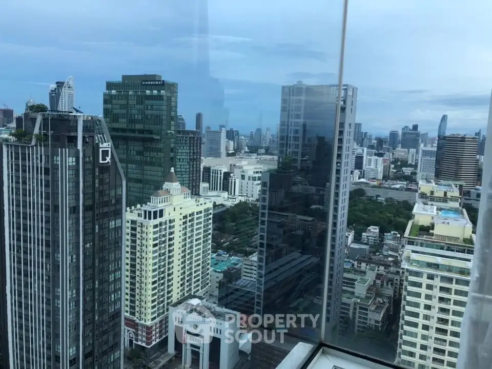 Stunning cityscape view from a high-rise building with expansive skyline and modern architecture.