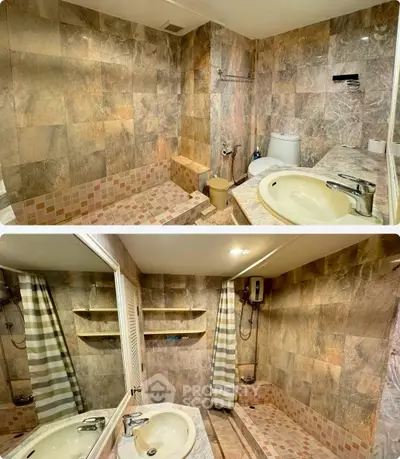Luxurious marble-tiled bathroom with modern fixtures and spacious shower area.