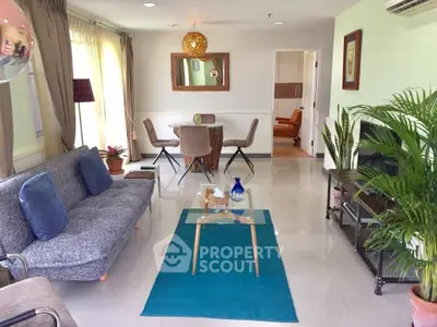 Stylish living room with modern decor and natural light, perfect for relaxation and entertaining.