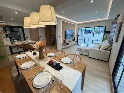 Modern open-plan living and dining area with stylish decor and natural light.