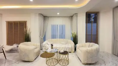 Luxurious living room with elegant white furniture and modern decor