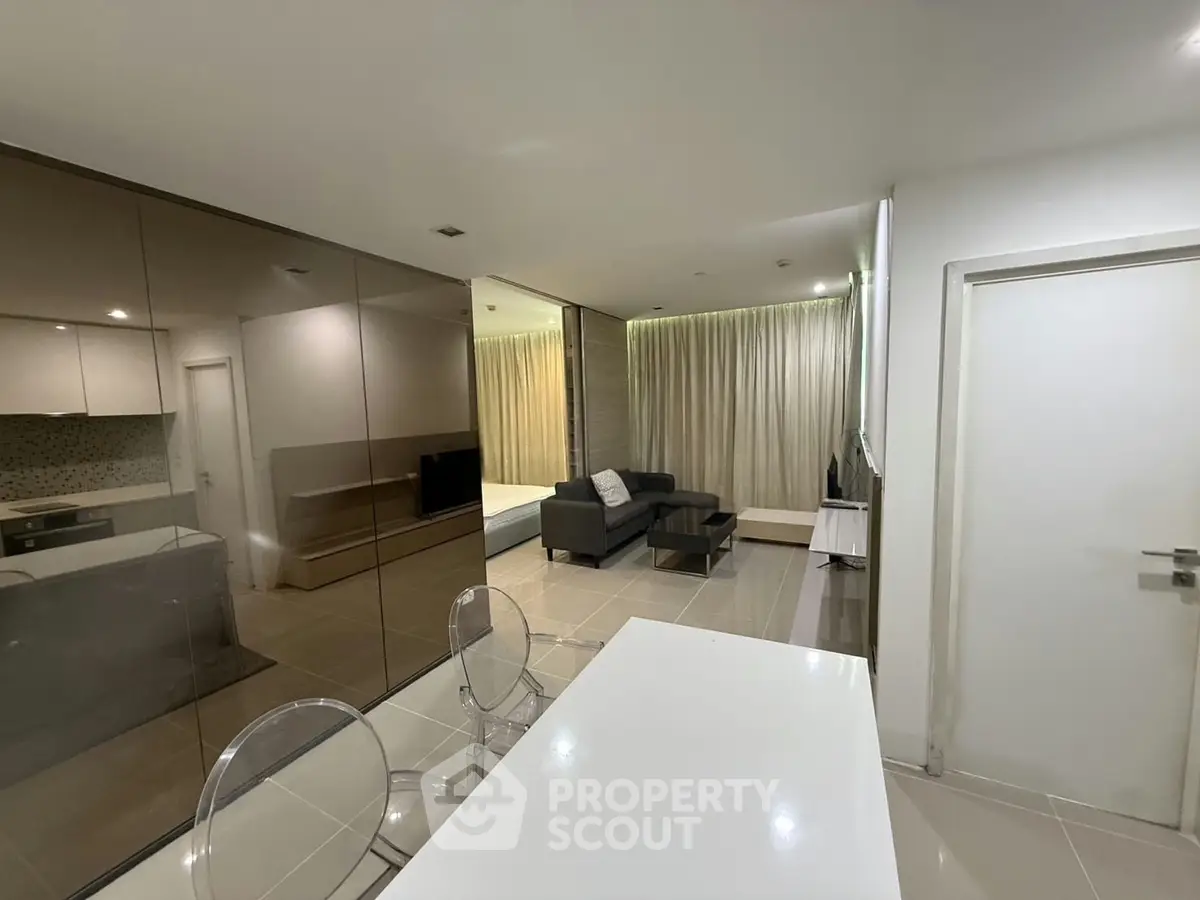 Modern open-plan living room with sleek design and stylish furniture
