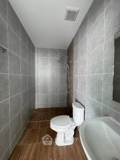 Modern bathroom with sleek gray tiles and contemporary fixtures