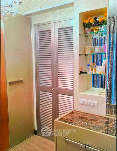 Modern bathroom with elegant storage solutions and marble countertop