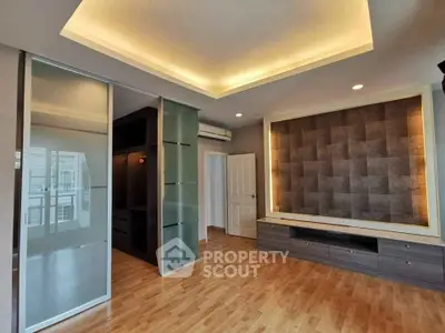 Modern living room with sleek design and ambient lighting