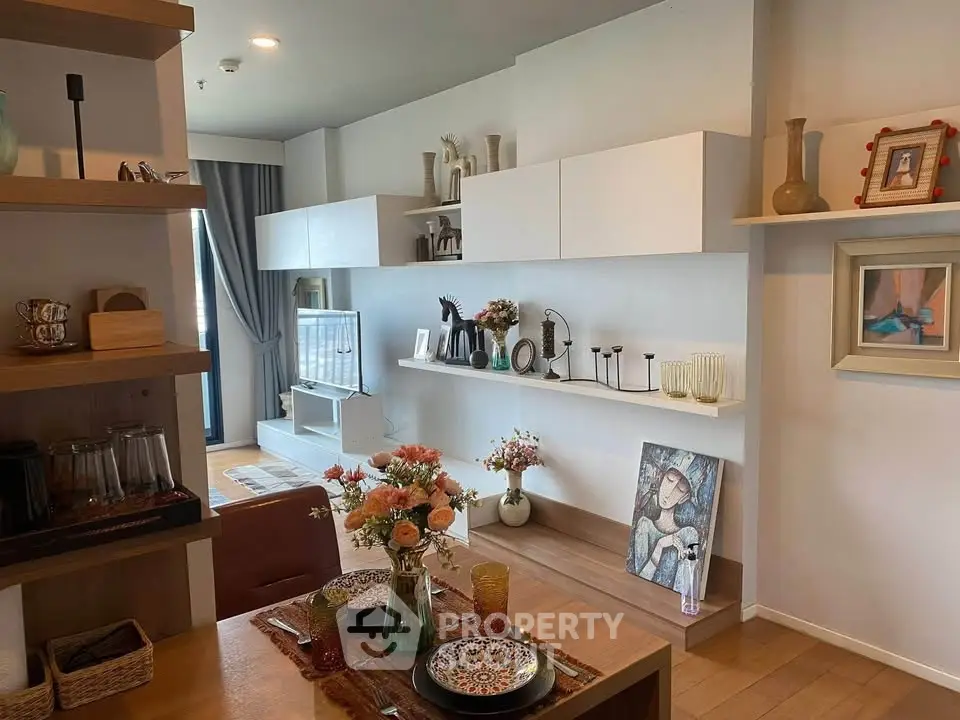 Stylish living room with modern decor and open shelving, perfect for contemporary living.