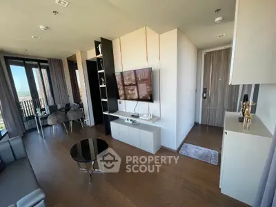 Modern living room with sleek decor and city view from balcony