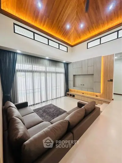 Luxurious living room with high ceiling and modern design