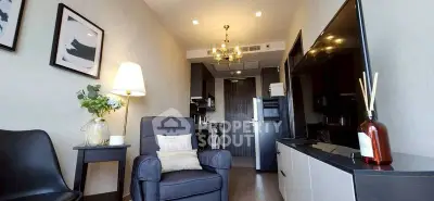 Modern living room with stylish decor and cozy seating in a contemporary apartment.