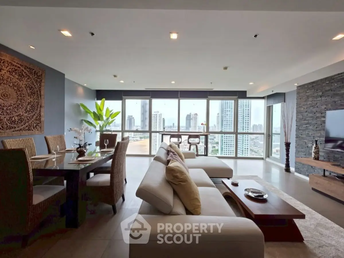 Luxurious open-plan living room with stunning city view and elegant decor